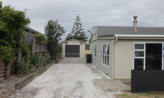 Waitarere Beach House | Discover HAPPY HAVEN: Kiwi Bach Charm by the Ocean