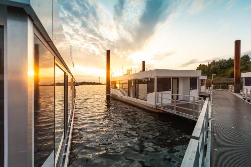 Rablinghausen Boat Rental | Discover Hausboote am Lankenauer Höft with Ocean Views
