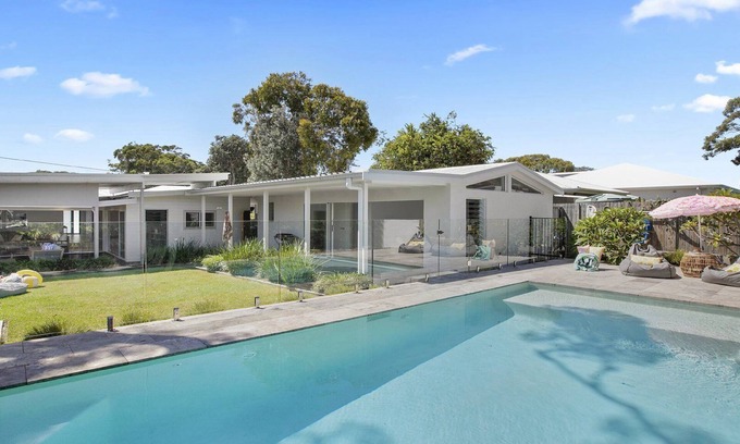 Bateau Bay House | Relaxing Retreat with Heated Pool Steps from the Beach