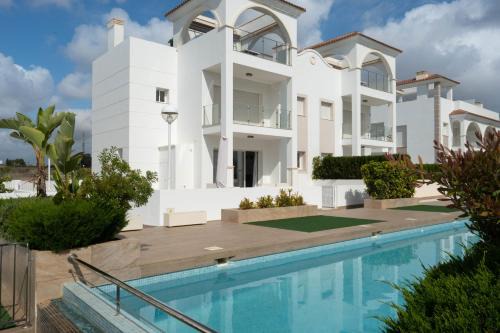Quesada Apartment | Elegant Helgafell Olivos Courtyard Suite with Pool Access