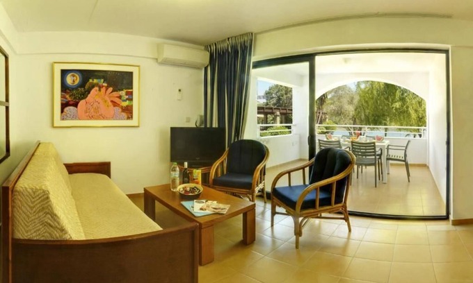 Gouvia Apartment | Beachside Retreat at Helion Resort: Oceanfront Duplex Escape