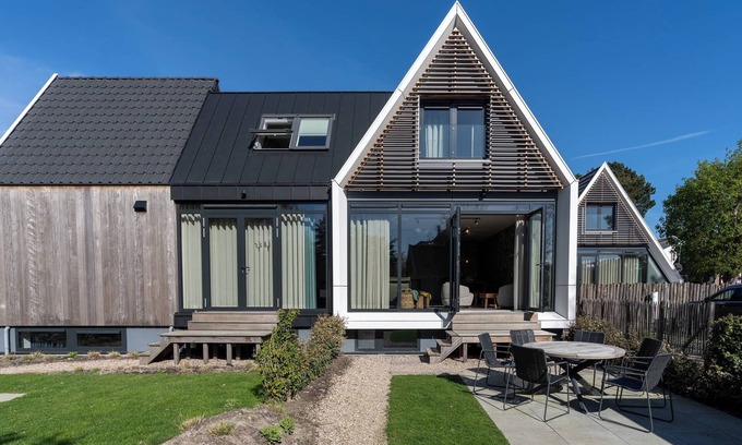 Oostkapelle Apartment | Cozy Duno Lodge I with Oceanfront Views in Hello Zeeland