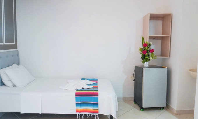 Covenas Hotel | Cozy Quadruple Room Steps from the Beach with Ocean View