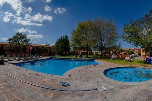 Desarrollo San Pablo Apartment | Guest Rated 10/10: Hermosa Suite with Pool & Green Areas