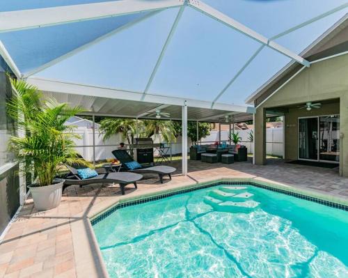 Bearss Plaza House | Escape to Poolside Paradise: Oceanfront Family Retreat