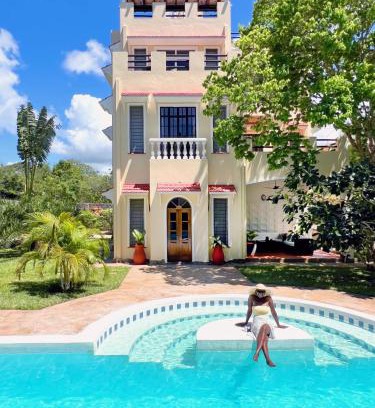 Diani Beach Bed & Breakfast | Experience Hilda's Homestay: Oceanfront Gem with Pool