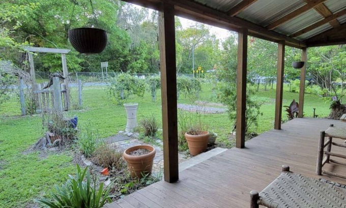 Worthington Springs Cabin | Historic Cabin Retreat with Spa Near Springs and UF