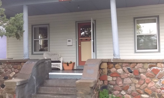 Cheyenne House | Historic Stone Porch House: Steps from Downtown Fun!