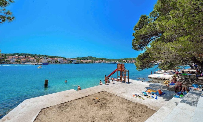 Kukljica Apartment | Family-Friendly Apartment with Pool and Playground Appeal