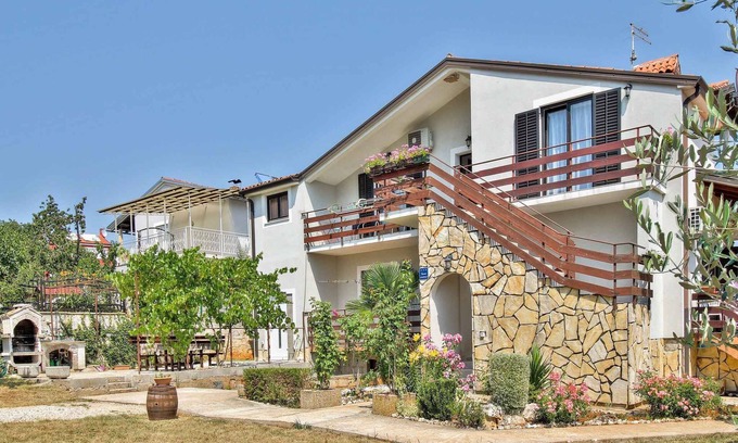 Valica Apartment | Oceanfront Getaway: Family Apartment with Lawn & BBQ