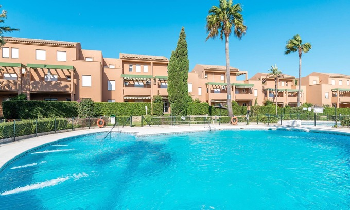 Chiclana de la Frontera Apartment | Elegant "Jardin del Golf" Apartment with Pool Near the Beach