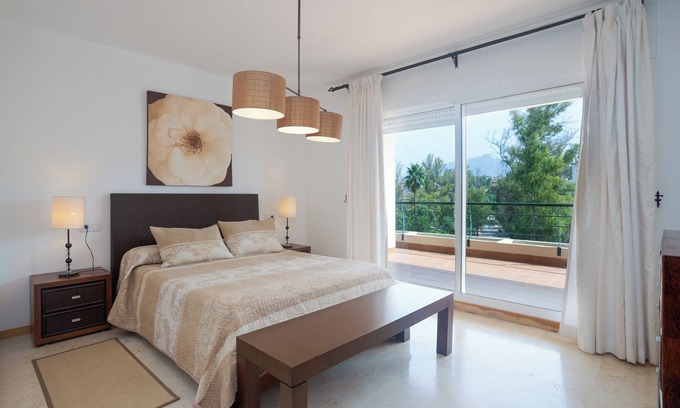 Guadalmina Apartment | Mountain View Holiday Apartment with Shared Pool & Wi-Fi
