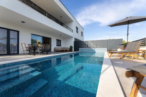 Kastel Stafilic House | Relax at Holiday Home Izzy with Oceanfront Views & Pool