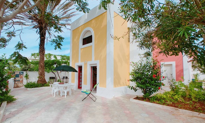 Posto Vecchio House | Scenic Villa Umberto: Oceanfront Stay with Shared Garden