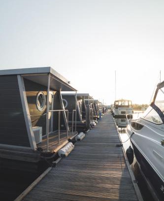 Dinteloord Boat Rental | Elegant Houseboat Zen with Oceanfront Views & Dining