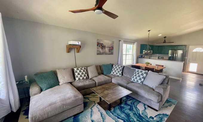 Alpine House | Enjoy a Home Theatre Experience with King Bed Retreat