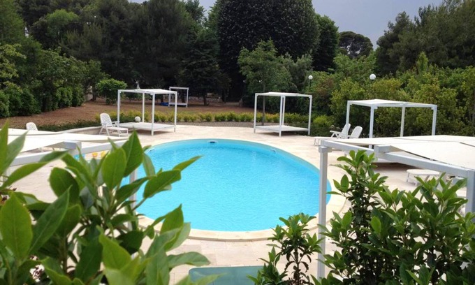 Laureto Apartment | Inviting Apartment Near the Beach with Shared Pool for 8
