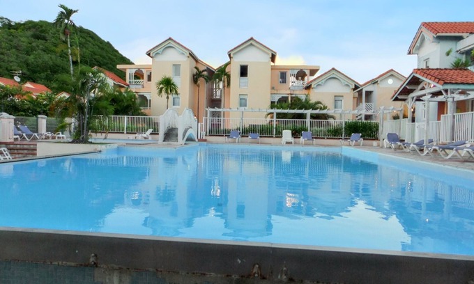 Sainte-Anne Apartment | Homerez - Apartment Sainte-Anne, pool