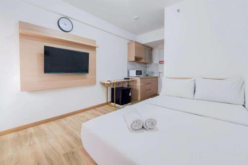 South Tangerang Apartment | Cozy Studio at Urbantown Serpong Apartment by Travelio