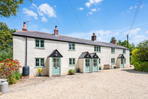 Buckland Newton House | Inviting Honeysuckle Cottage with Pool & Family-Friendly Vibes