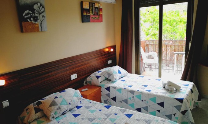 Aren House | Budget-Friendly Hostal Escarla with Family Amenities