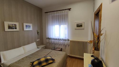 Abena House | Family-Friendly Hostal Escartín with Kitchen Amenities