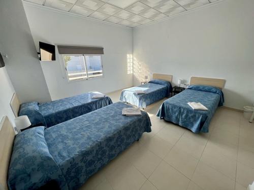 La Nucia House | Discover Hostal Kaizen: Family-Friendly with Kitchen Access