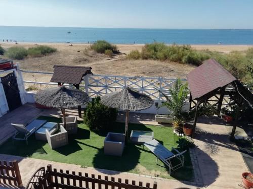 Mazagon House | Relax at Hostal Playa Mazagon with Oceanfront Views