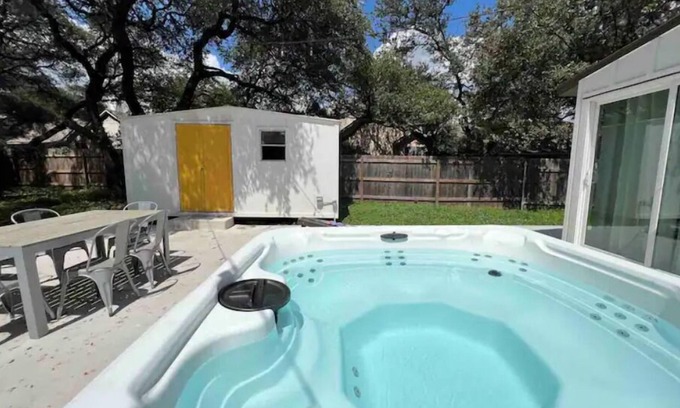 Milwood House | Relaxing Hot Tub Retreat: Chic Domain 4 BR + Foosball