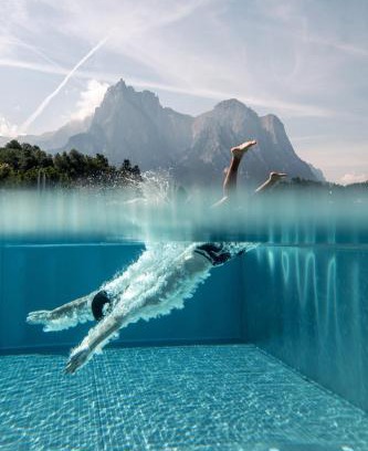 Kastelruth Hotel | Pet-Friendly Hotel Alpenflora: Guest Rated 9.3 with Ocean Views