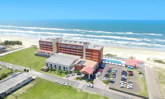 Capao da Canoa Hotel | Discover Hotel Araçá: Oceanfront Bliss with Pool Access