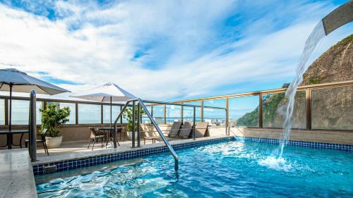 Copacabana Hotel | Discover Hotel Atlântico Rio: Poolside Relaxation Awaits