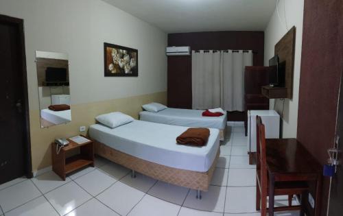 Nova Xavantina Hotel | Discover Hotel Central: Family-Friendly with Pool & Dining