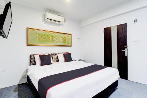 Padang Hotel | Budget-Friendly OYO 433 Nelvi Guest House with Family Perks