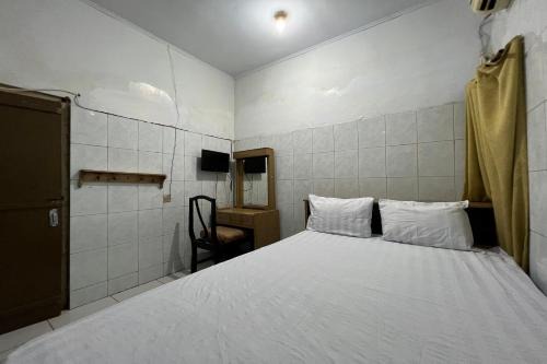 Paso Hotel | Budget-Friendly Comfort at OYO 94023 Kost Stan