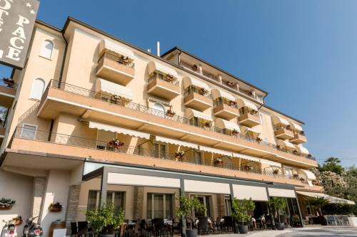 Torri del Benaco Hotel | Pet-Friendly Hotel Pace: Rated 8.5/10 with Family Amenities