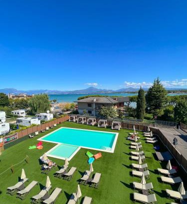 Peschiera del Garda Hotel | Experience Hotel Puccini: Oceanfront with Pool & Hot Tub