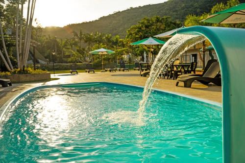 Tubarao Hotel | Discover Hotel Sandrini: Oceanfront Escape with Spa & Pool