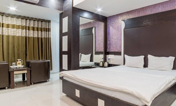 Akhol Hotel | Discover Hotel Zorba in Deesa: Rated 8/10 with Great Amenities