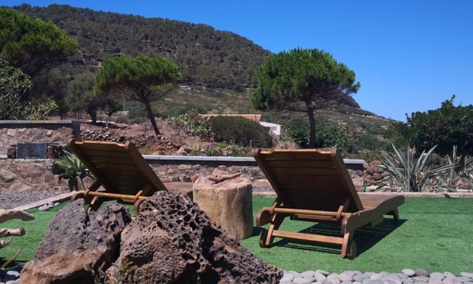 Ustica Apartment | Cozy Retreat with Aromatic Garden and Outdoor Amenities