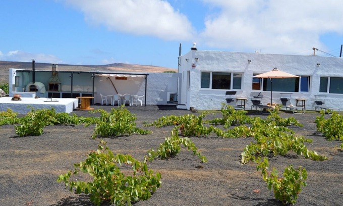 Ye House | Scenic Retreat with Volcano Views, Garden & Oceanfront Bliss