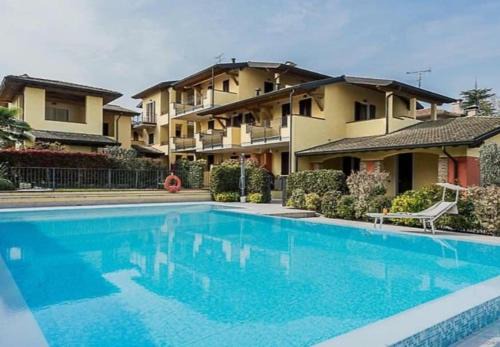 Lugana Apartment | Inviting HOYA APARTMENT: Rated 9.8 with Pool & Family Perks