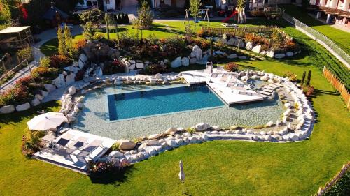 Naz Apartment | Huberhof: Family-Friendly Hotel with Oceanfront Pool