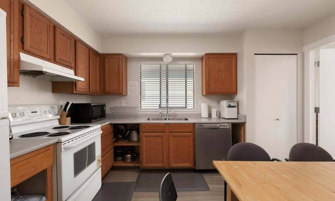 Riley Park Apartment | Spacious 4-Bedroom Upper Suite with Kitchen & Spa Access