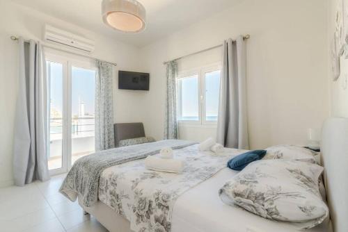 Milatos Beach Apartment | Inviting Ikaros Apt Steps from the Beach for Families