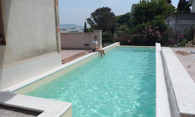 Monterubbiano Apartment | Inviting Country Apartment with Infinity Pool & Unique Amenities