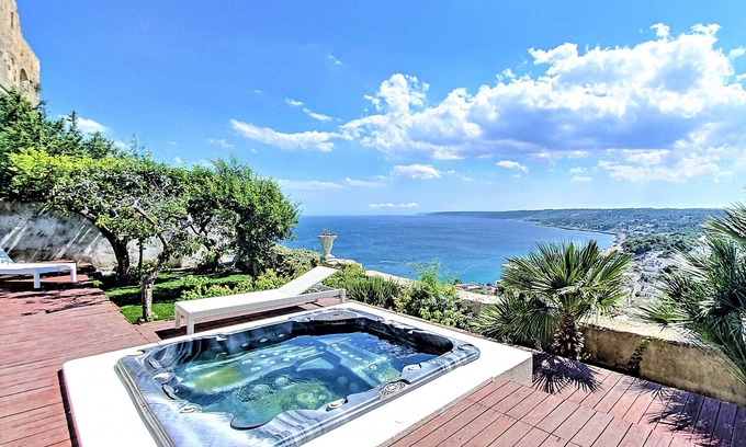 Castro Marina Ski Chalet | Relax by the Outdoor Jacuzzi with Spectacular Sea Views