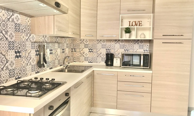 Cattolica Apartment | Central Retreat with Terrace, Wi-Fi & Ocean View Amenities