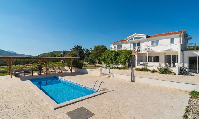 Trnbusi House | In the hinterland of Omis you will find this stylishly furnished, extremely spacious vacation home w