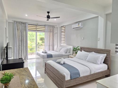 Panglao House | Top-Rated INATO SUITES with Kitchen & Pet-Friendly Options